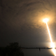 A long exposure photo showing the stream of light left by a SpaceX rocket at takeoff.